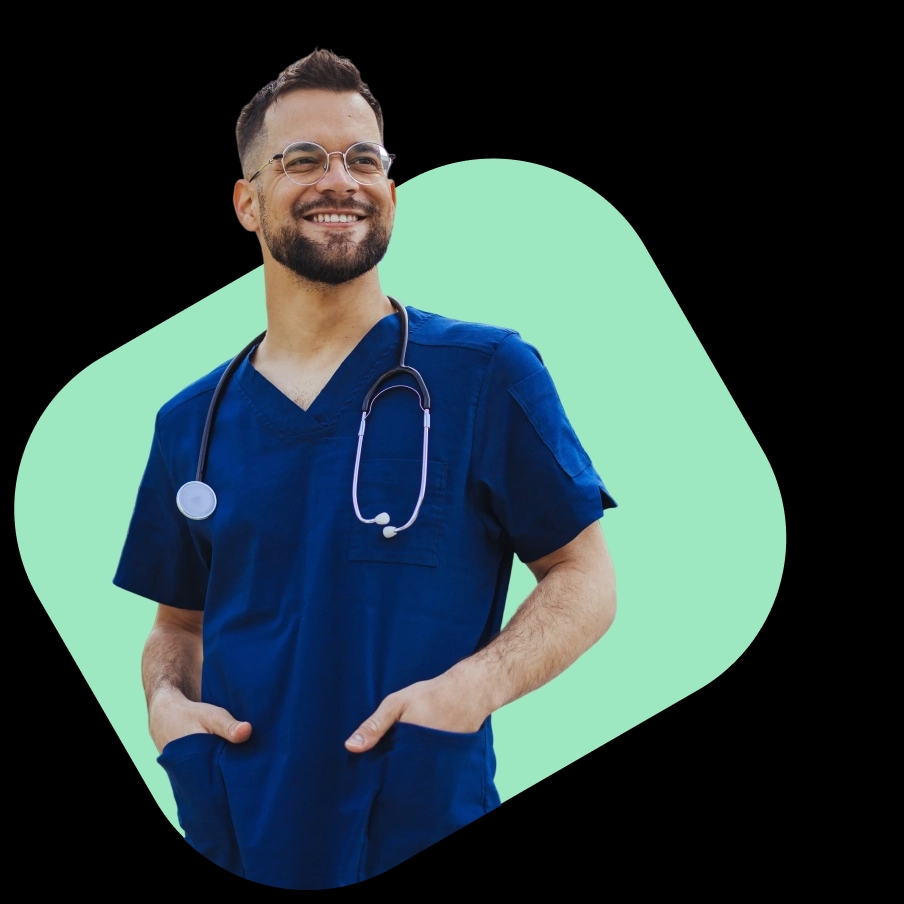 A smiling male clinician in blue scrubs and a stethoscope, representing NowPatient's online prescription treatment service.