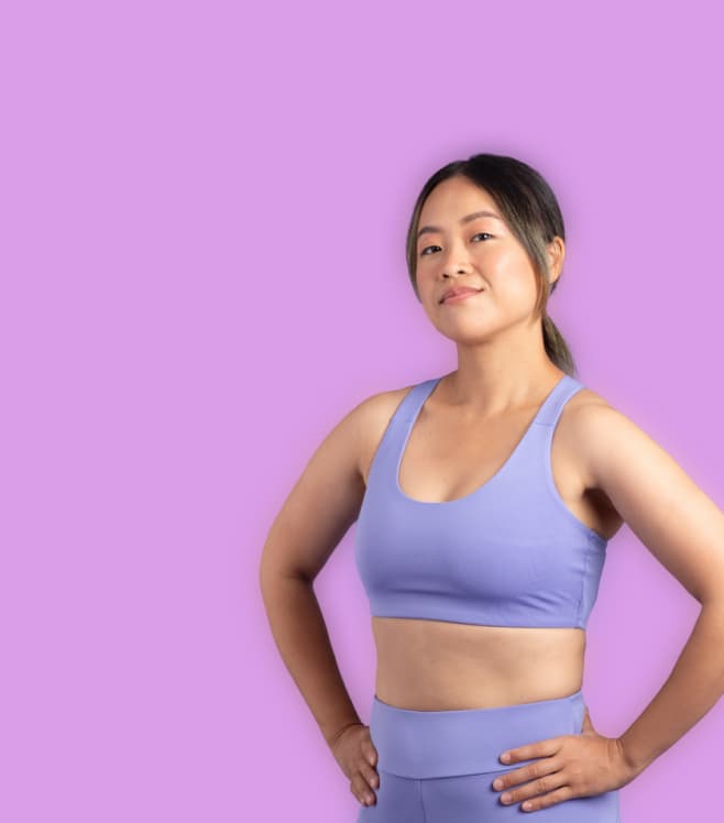 A woman in athletic wear standing confidently against a purple background, representing NowPatient’s weight loss program services