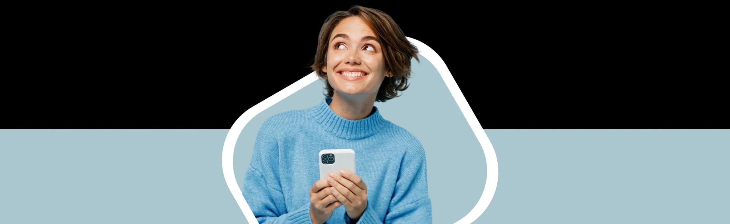 A smiling woman in a blue sweater holding a smartphone, exploring NowPatient's private health insurance quotes from FCA-regulated partners.