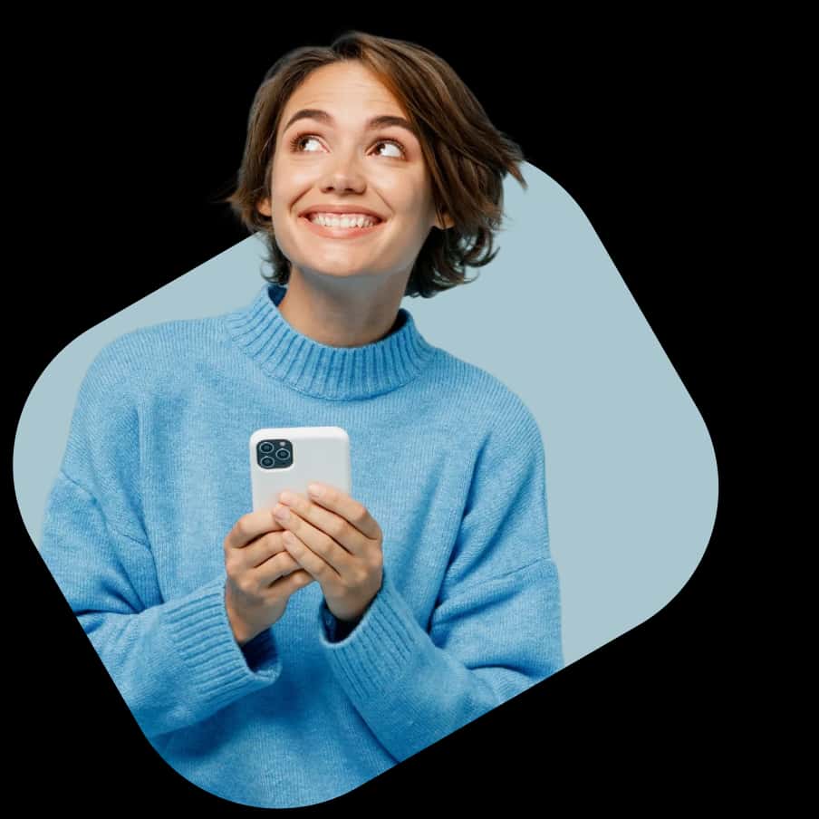A happy woman in a blue sweater using her smartphone to access NowPatient's online healthcare services.