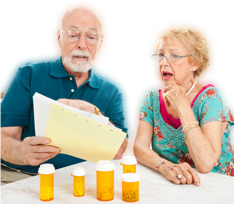 An elderly couple reviewing documents with prescription bottles on the table, appearing concerned or thoughtful due to insufficient information provided.