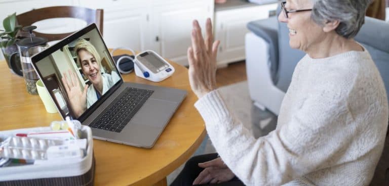 Image of patient seeing a NowPatient clinician over a live video feed